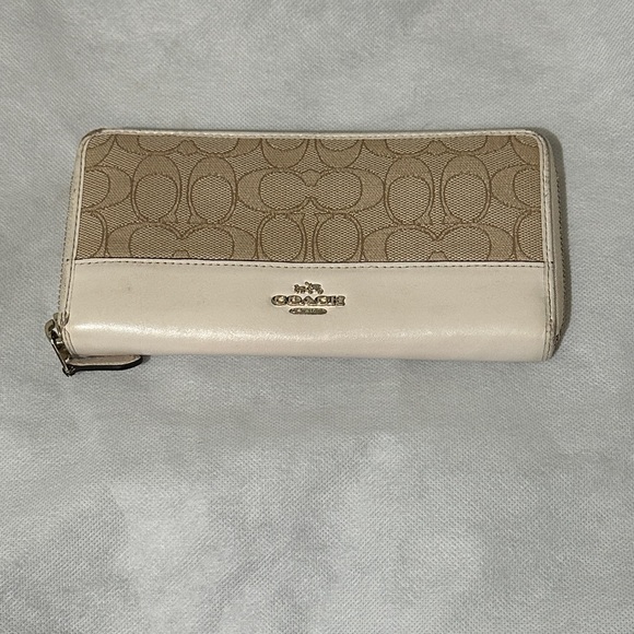 Coach Handbags - Coach Tan and Cream Zip Wallet